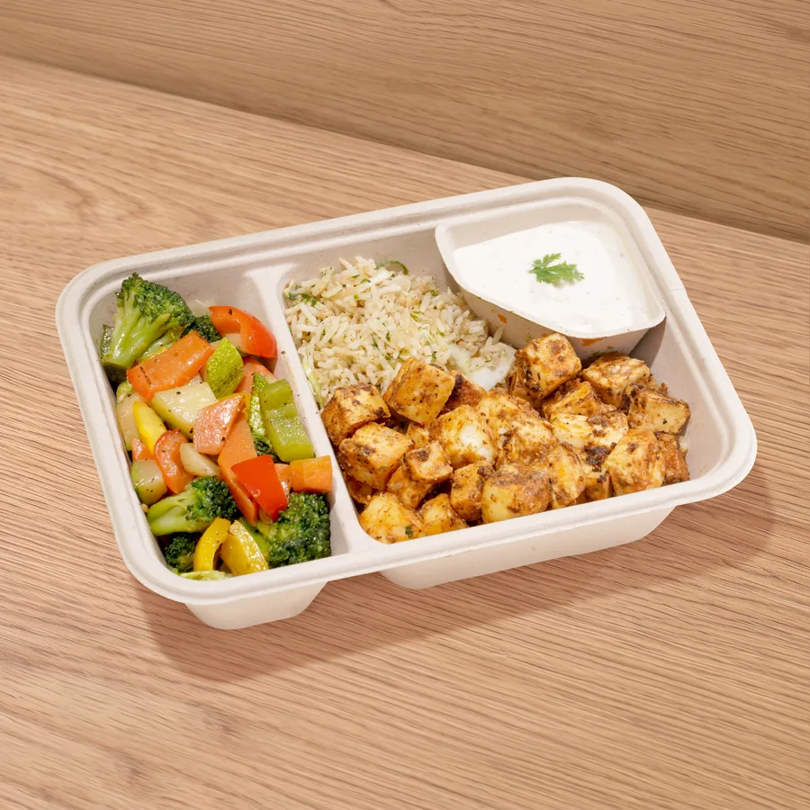 A FOJO tray of chipotle paneer with herb rice, saut&eacute;ed vegetables and garlic yogurt