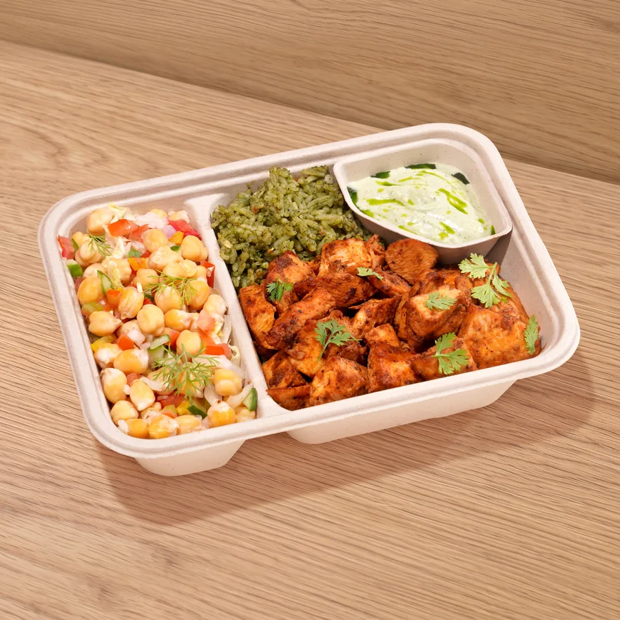A FOJO tray of peri peri chicken with herb rice, chickpea salad and mint yogurt