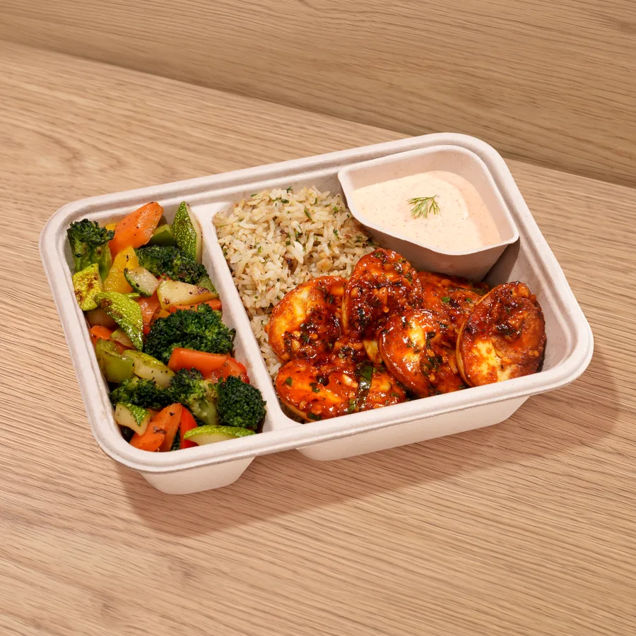A FOJO tray of peri peri eggs with saut&eacute;ed vegetables, brown rice and a yogurt dip