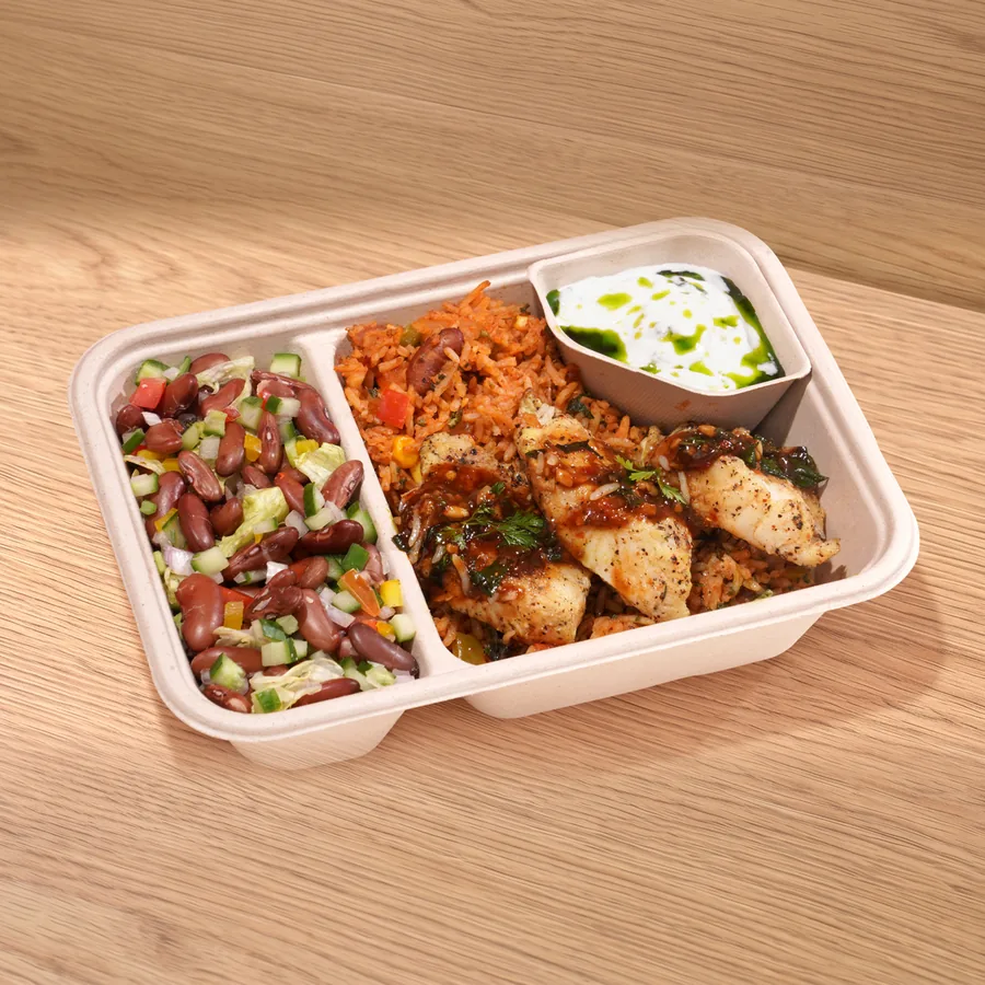 A FOJO tray of Thai basil fish with tomato rice, a kidney bean salad and a herb yogurt dip
