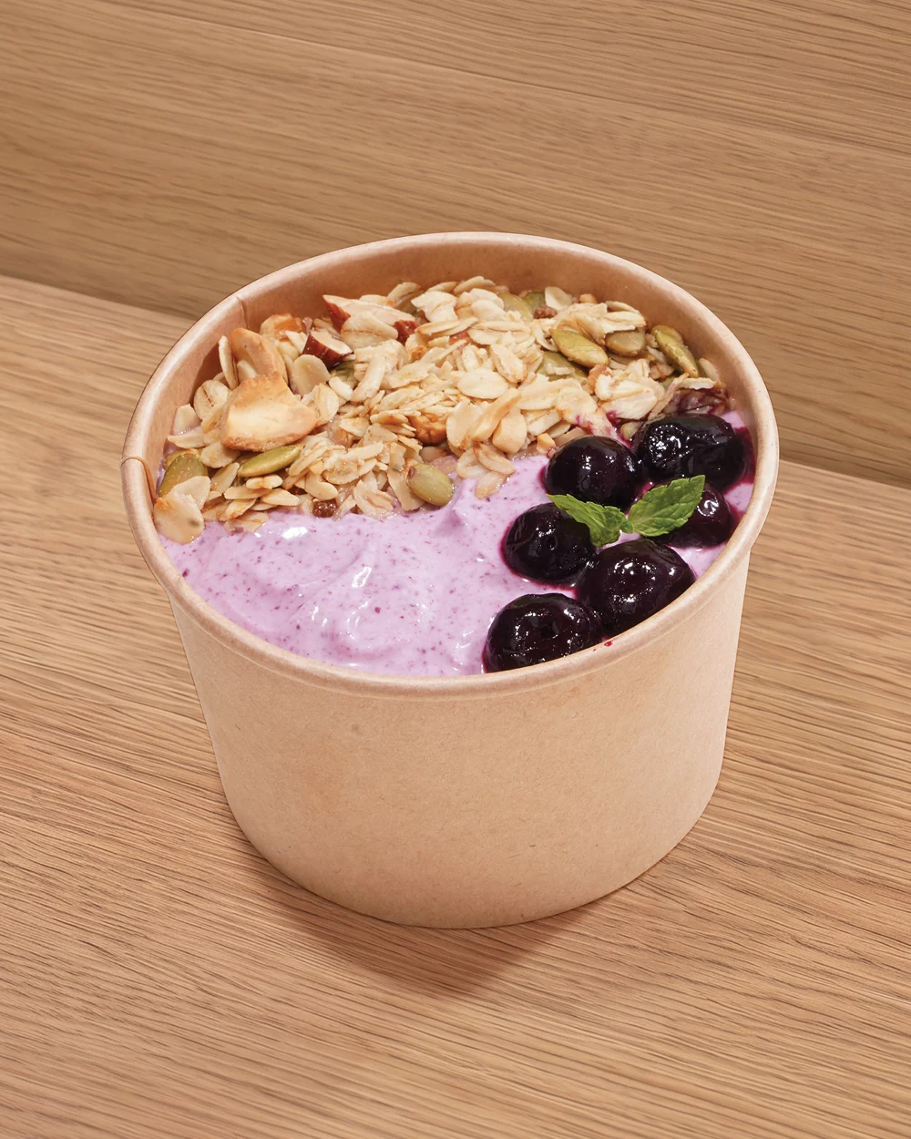 A FOJO yogurt bowl with granola and blueberries